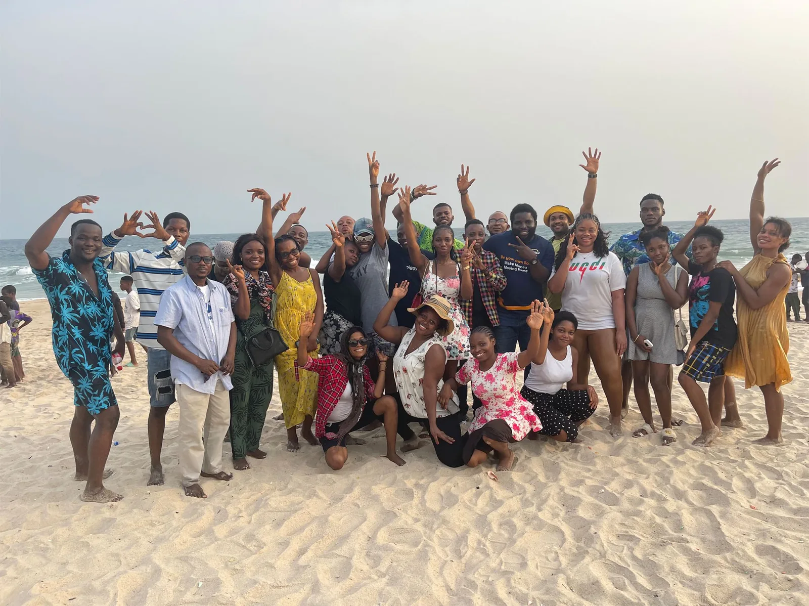 A large SkillUp Africa group enjoying a community gathering on a beach