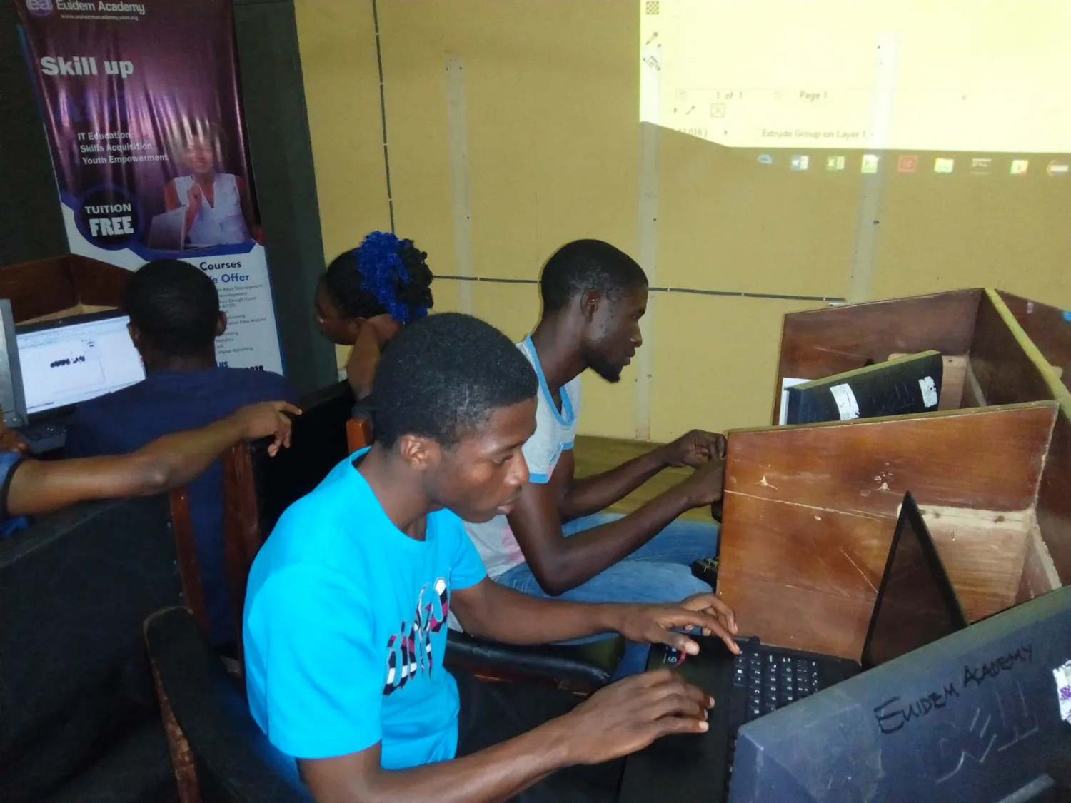 SkillUp Africa learners practising on laptops during a digital workshop